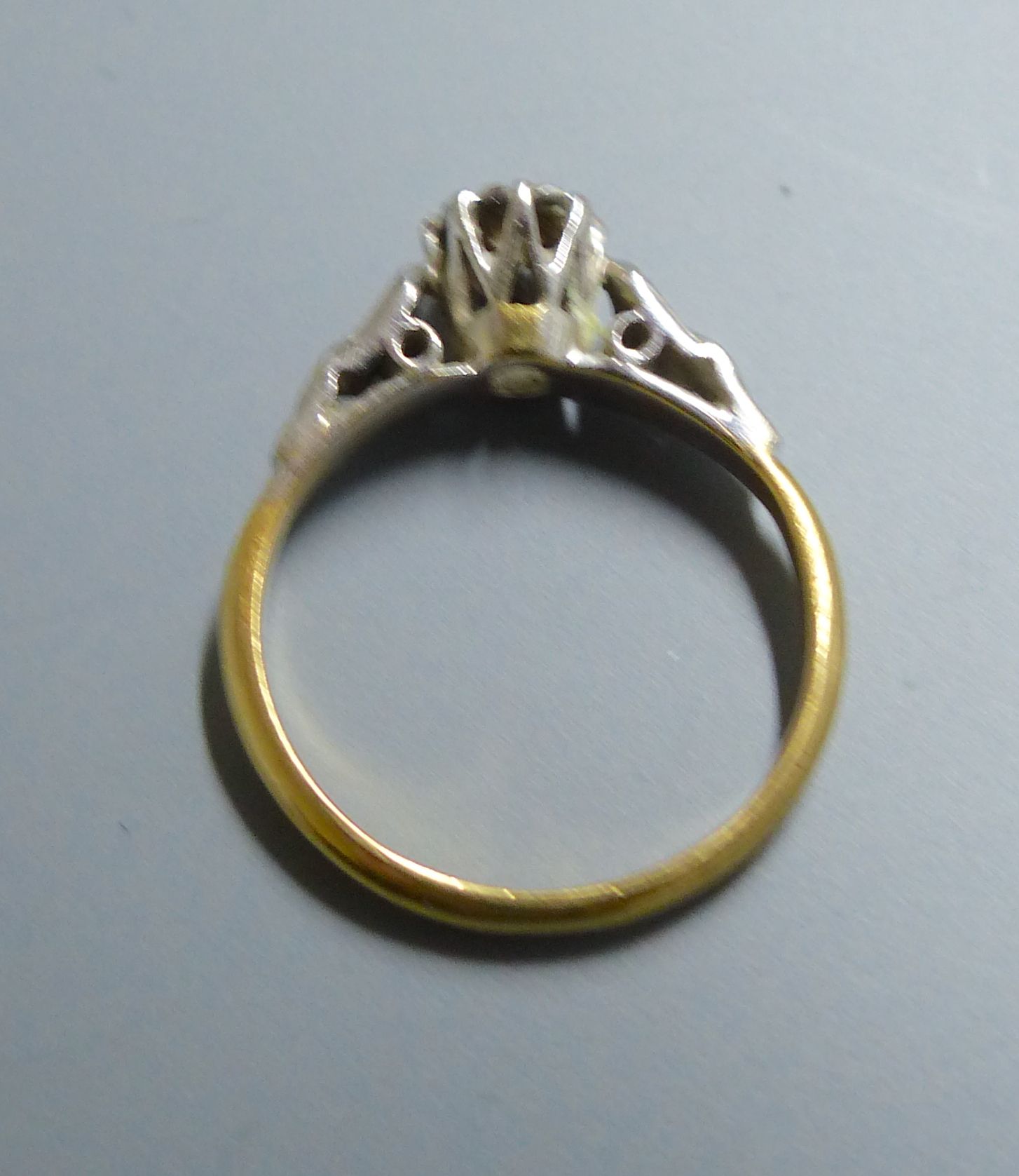 A 1960s 18ct gold and illusion set solitaire diamond ring, size J/K, gross 2.4 grams.